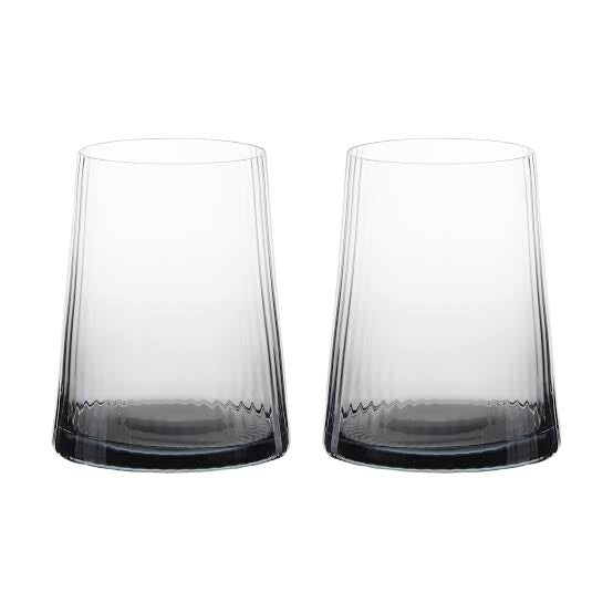 A pair of smoked drinking glasses with a fine, vertical optic which runs up and down the glass 