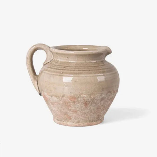 Beige ceramic pitcher