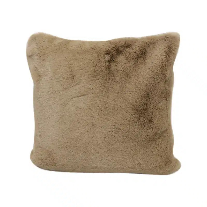 A square-shaped faux fur cushion in a beige color, with a plush texture