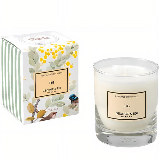 Glass candle with 'Fig' scent by George & Edi, next to its packaging 