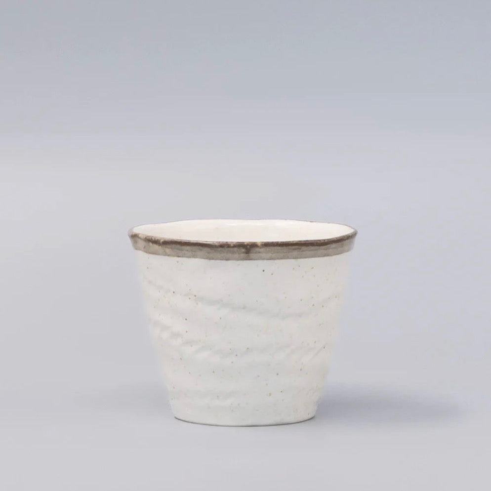 White ceramic mug with brown rim 