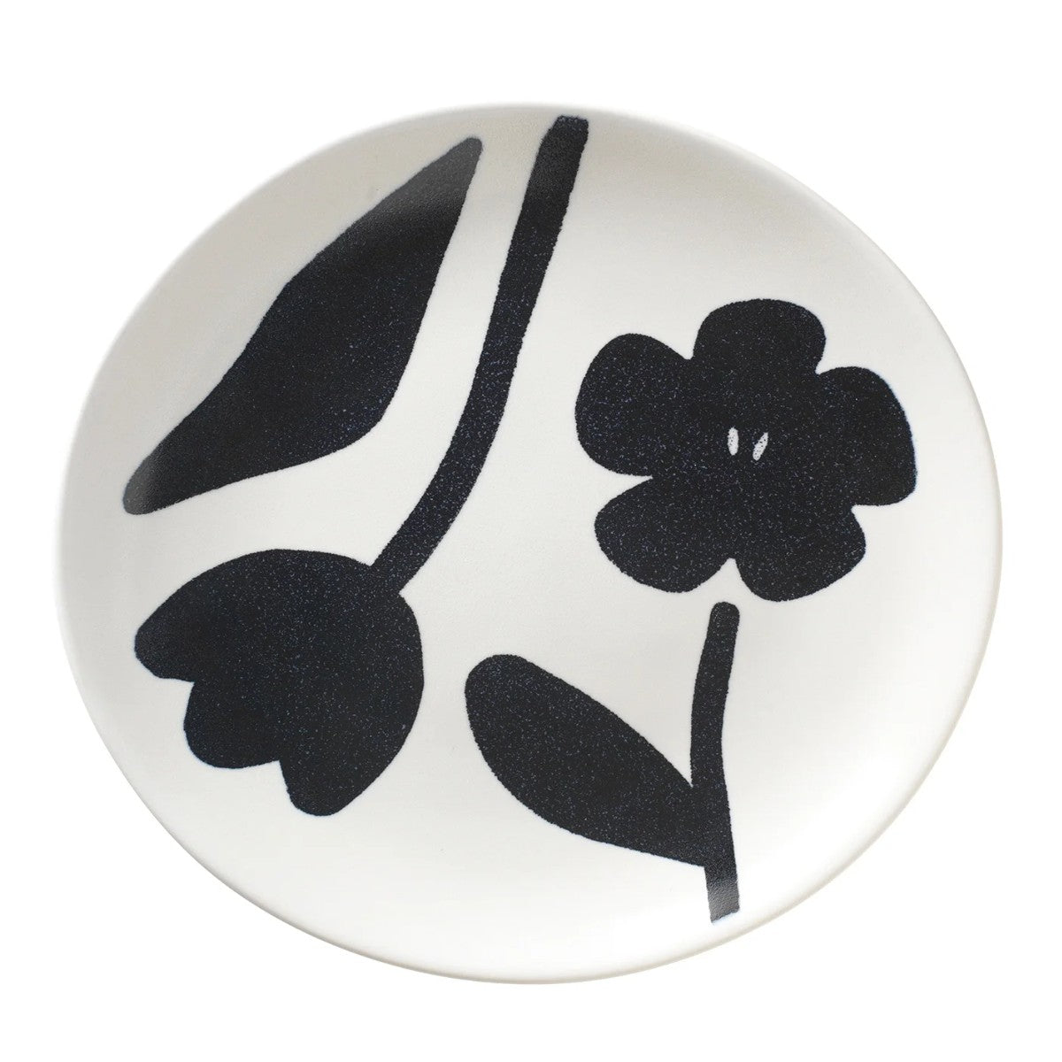 Round white plate with black floral design 