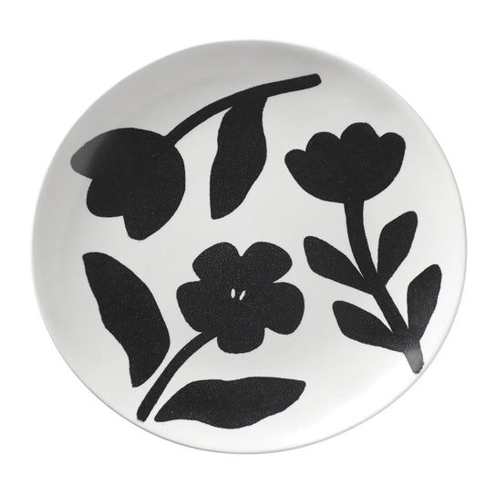 Round white plate with black floral patterns