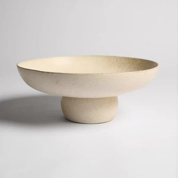 Beige ceramic bowl on a stand 