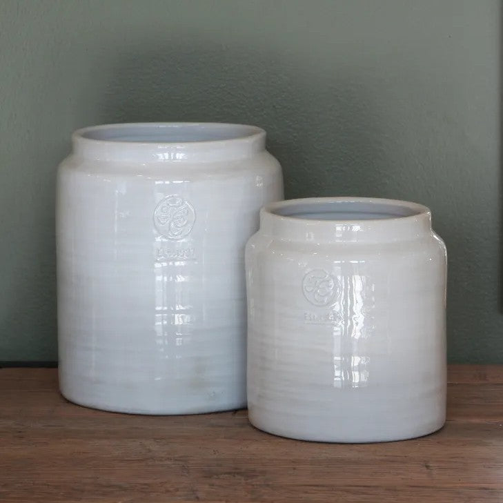 Two white ceramic jars
