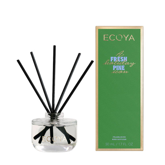Ecoya diffuser with black reeds and green packaging 