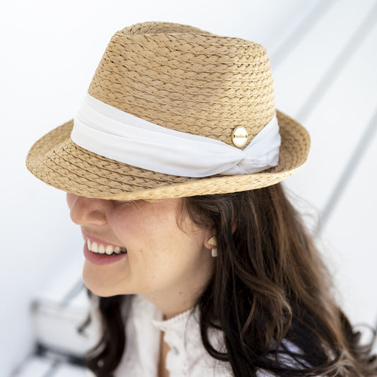 sunhat with white trim and gold label 