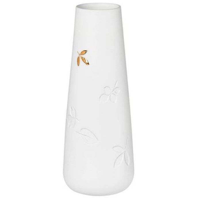 A white porcelain vase with gold details and leaf patterns.