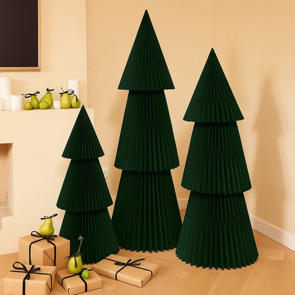 Set of green pleated trees with presents and pears on a wooden floor.