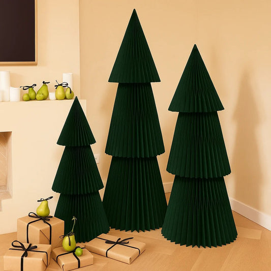 Set of green pleated trees with presents and pears on a wooden floor.