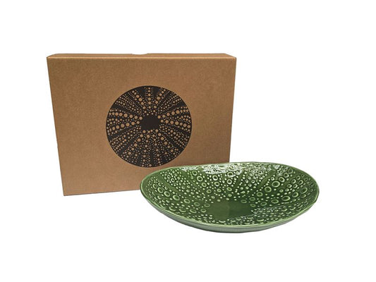 Green ceramic plate with textured design in the form of a Kina 