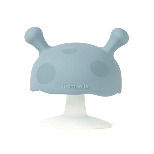 A green silicone teether in a mushroom shape designed for babies.