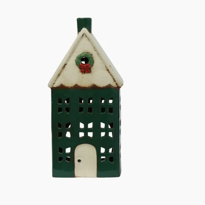 Decorative house-shaped lantern with a wreath