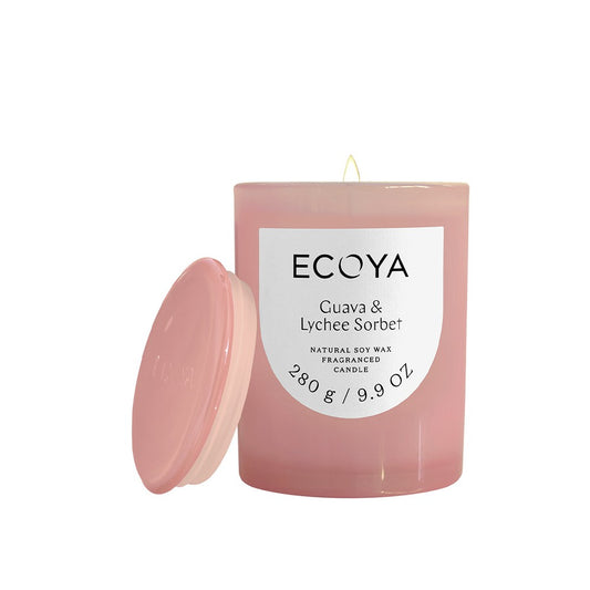 Pink Guava Lychee Ecoya candle with a white label on a white background