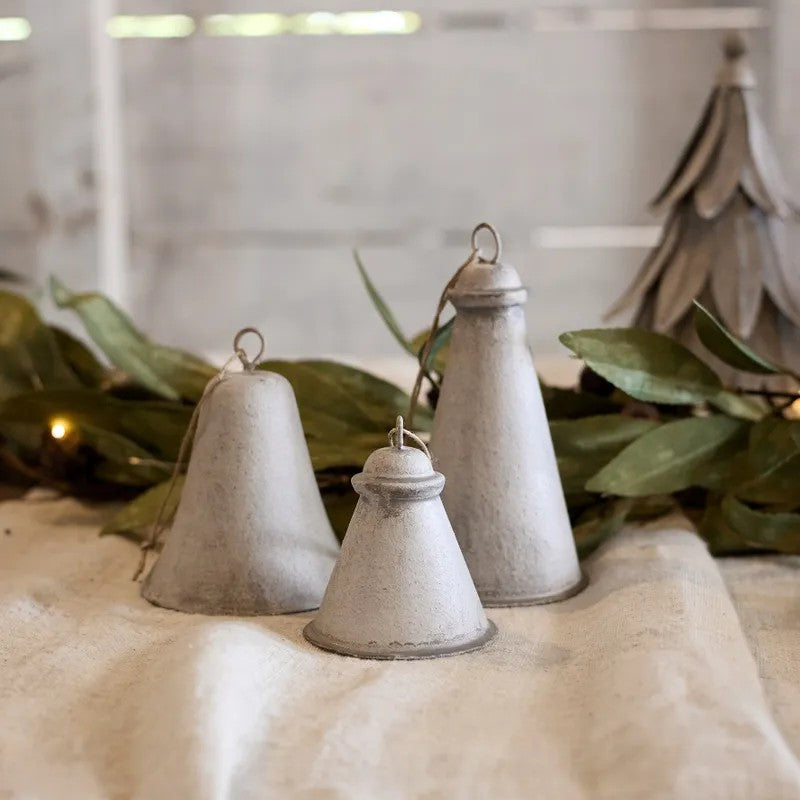 Three rustic metal bells 