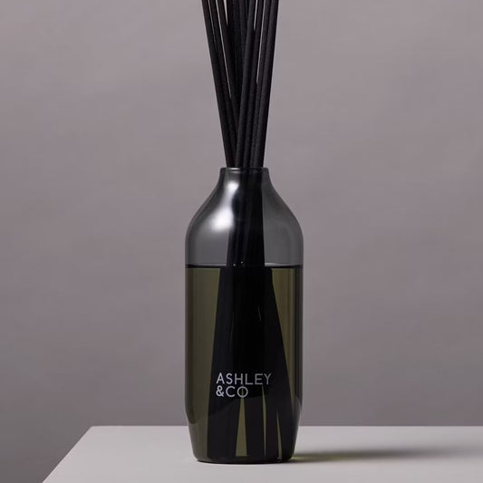 A black reed diffuser with the brand name 'Ashley & Co' 