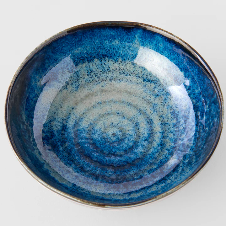 Blue ceramic bowl with concentric circle pattern 