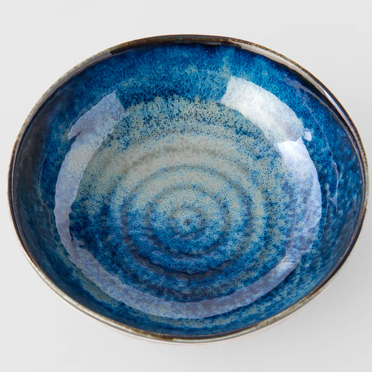 Blue ceramic bowl with concentric circle pattern 