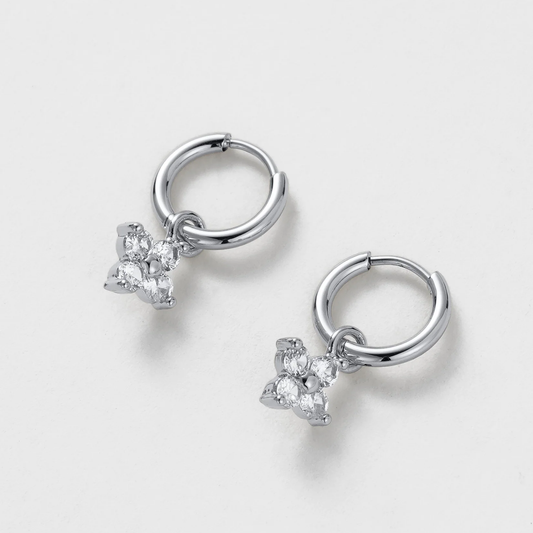 Pair of silver hoop earrings with star-shaped gemstones 