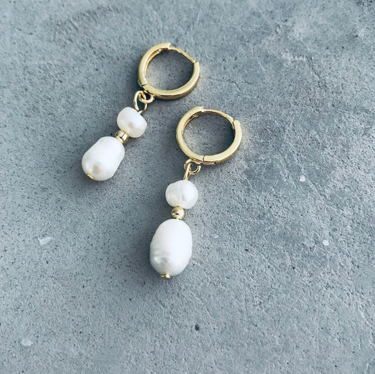 Gold hoop earrings with pearl drops