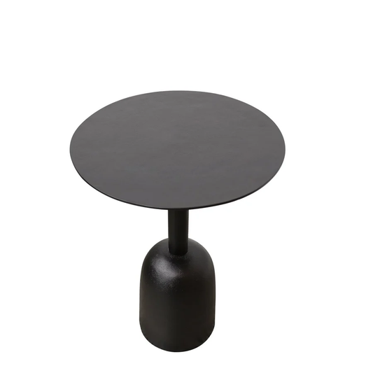 A modern round side table with a matte black top and a sculptural bell-shaped base
