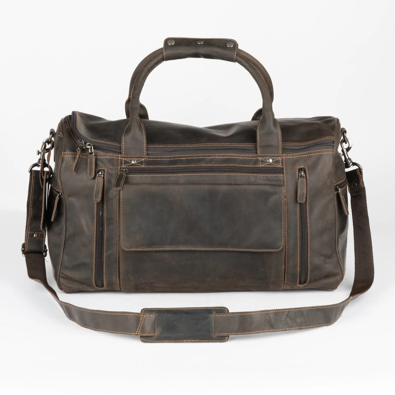 A large brown leather duffel bag with a smooth zipper, adjustable strap, and a padded compartment for laptops or similar sized devices.