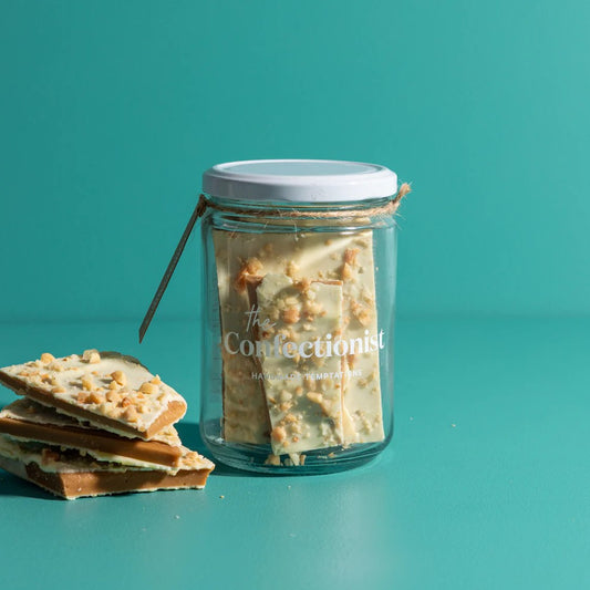 Jar of confectionery with a visible brand name on a teal background