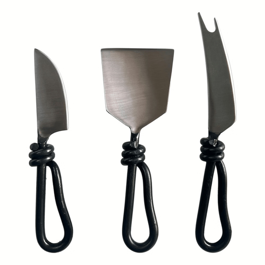 Set of three metal cheese knifes.