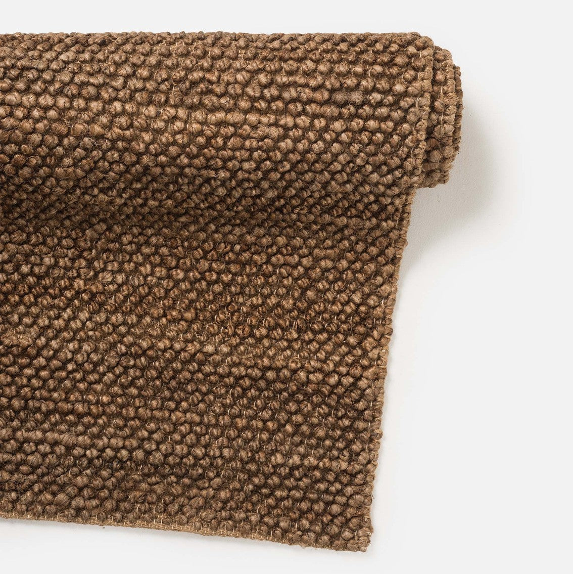 Brown textured fabric roll on a white background