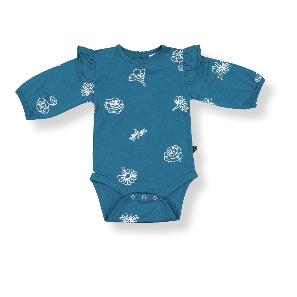A blue merino wool bodysuit for babies with a pattern of white wildflowers and leaves