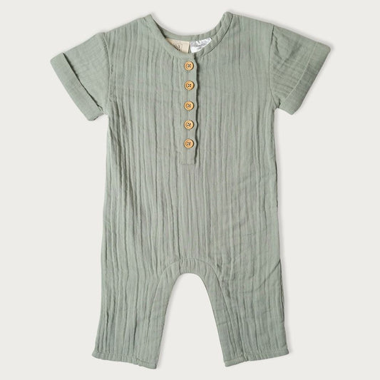 A green striped muslin romper with short sleeves, wooden buttons, and snap domes for babies.

