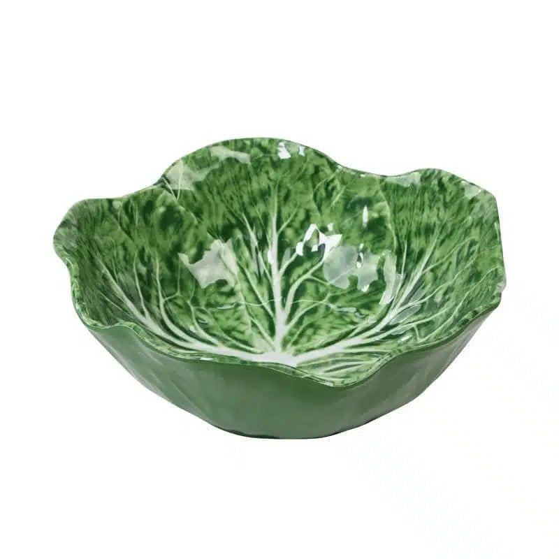 Green ceramic bowl designed to resemble a cabbage leaf on a white background

