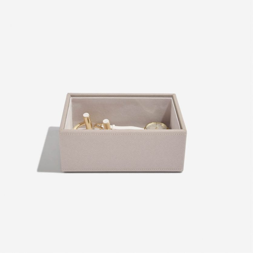 A taupe and grey jewellery box with a deep open compartment 