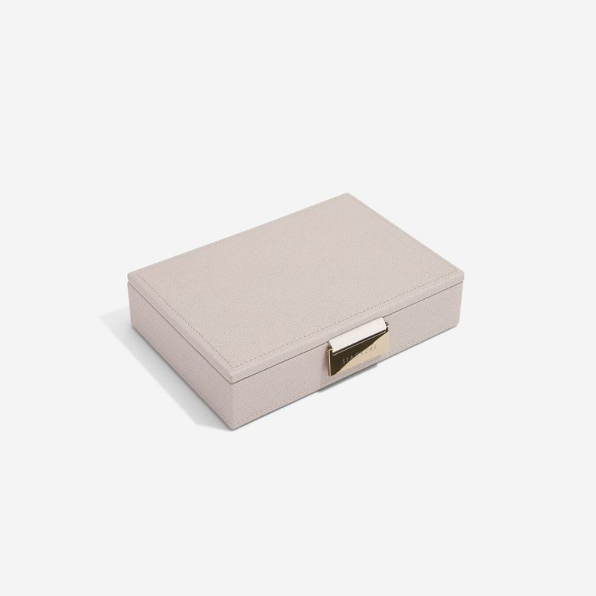 A taupe coloured jewellery box lid with a metal clasp, 