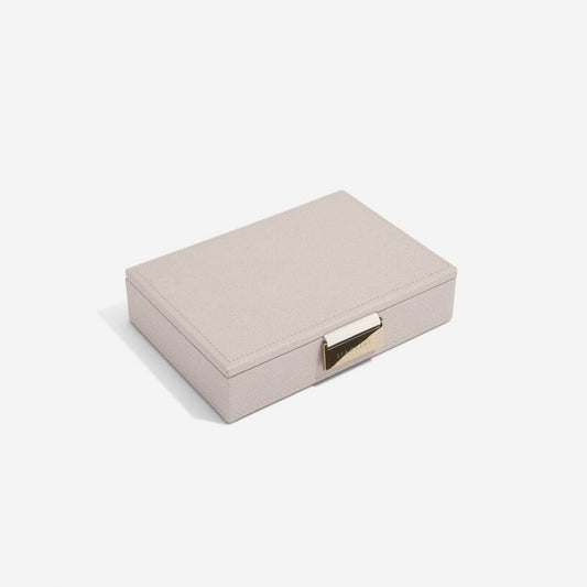 A taupe coloured jewellery box lid with a metal clasp, 