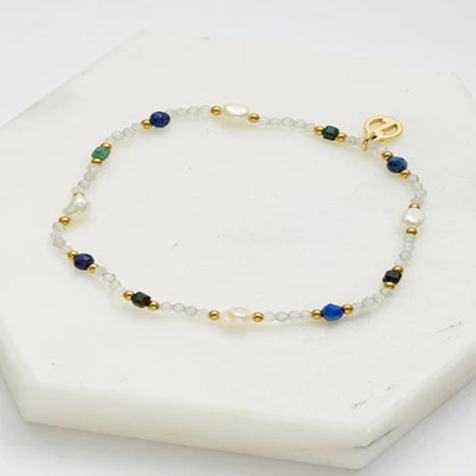 Beaded bracelet with blue, gold, and clear beads 