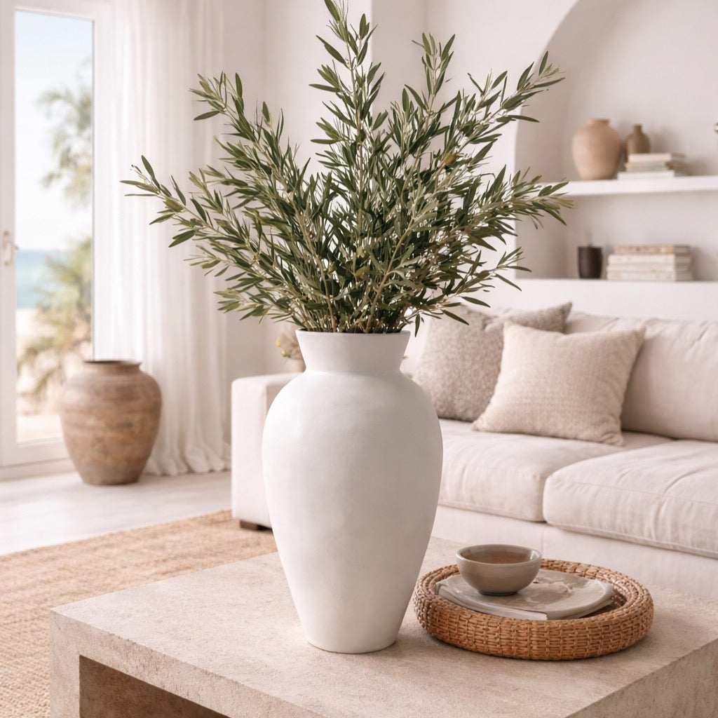 Greek inspired living room with large white ceramic vase
