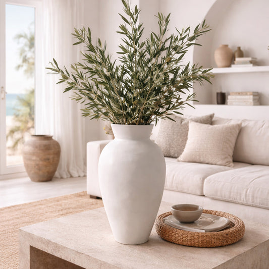 Greek inspired living room with large white ceramic vase