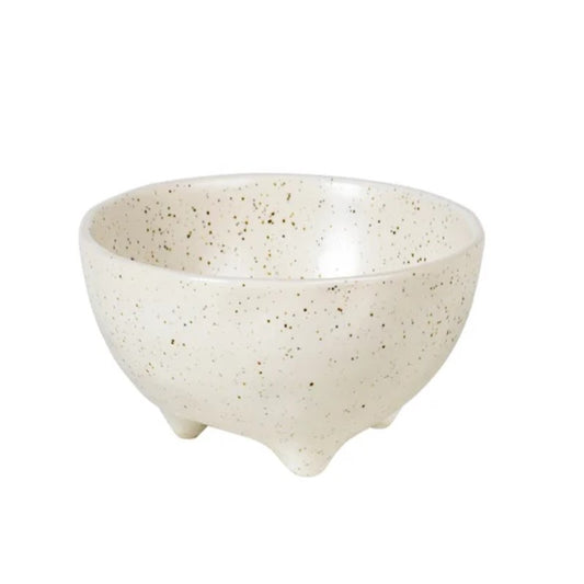 A speckled beige ceramic bowl with feet, part of the Broste Nordic Vanilla collection.