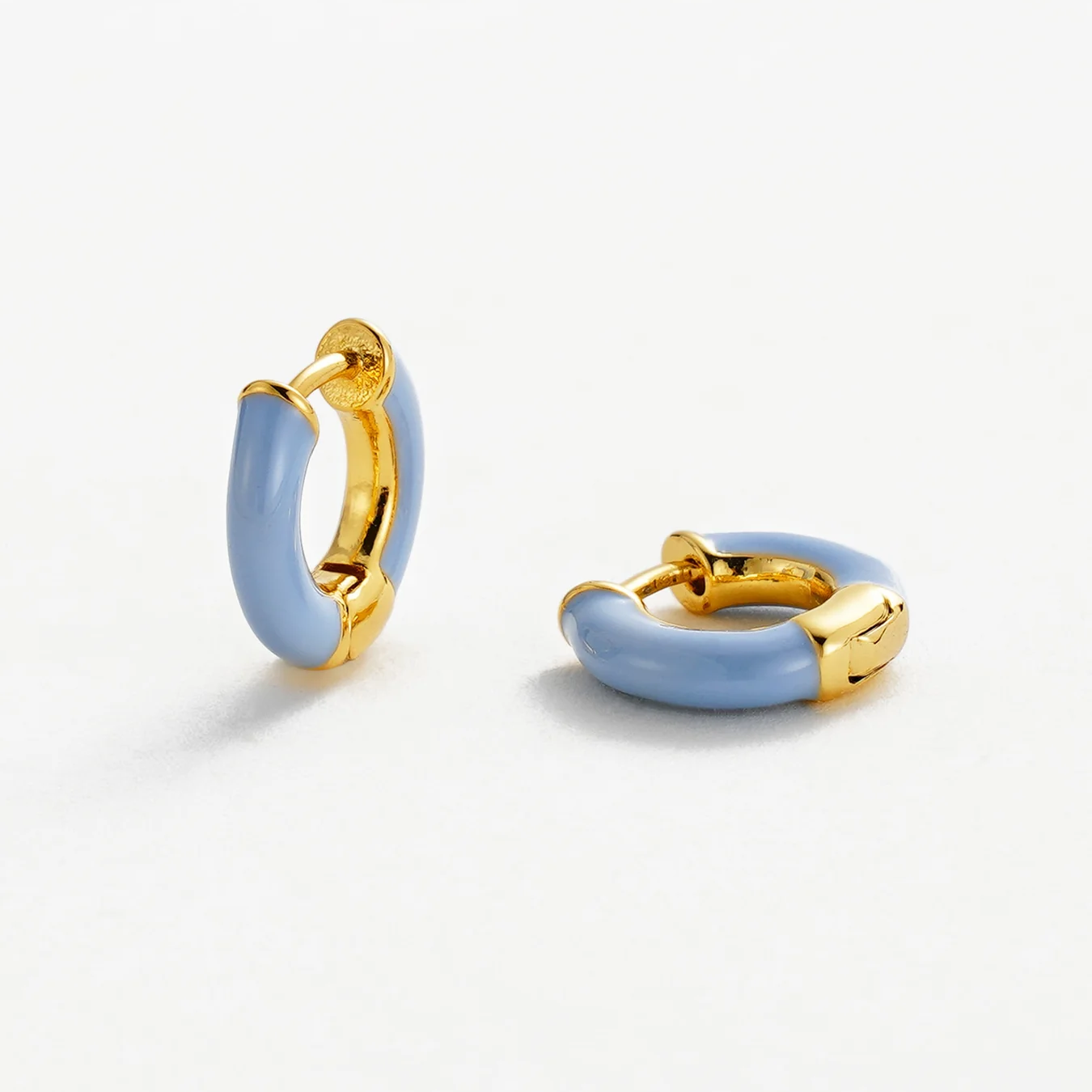 Pair of gold and light blue hoop earrings