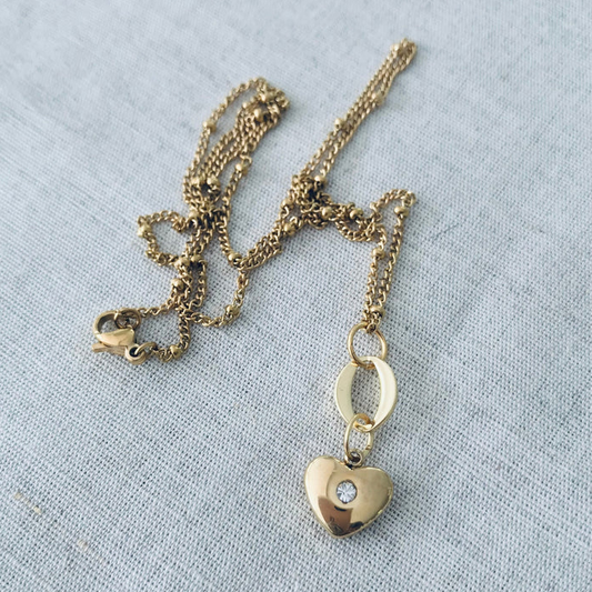 Gold necklace with a heart-shaped pendant 
