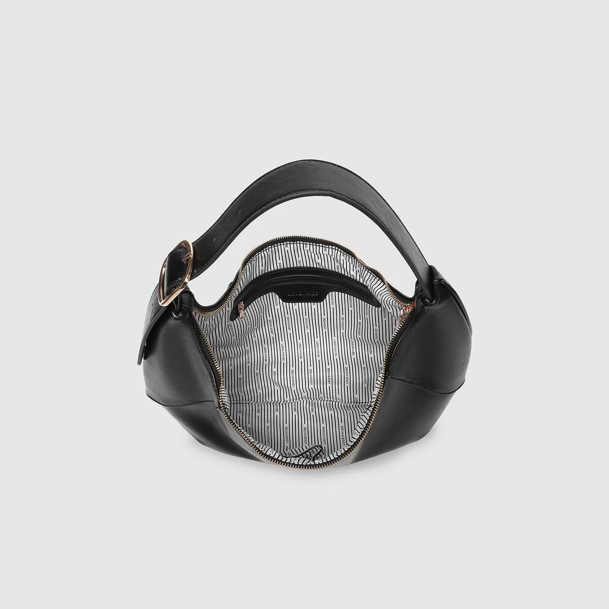 Black handbag with a textured pattern inside