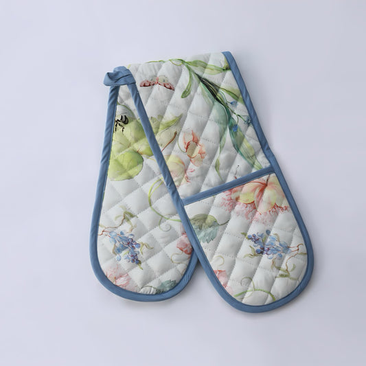 Floral-patterned oven mitts with blue trim 