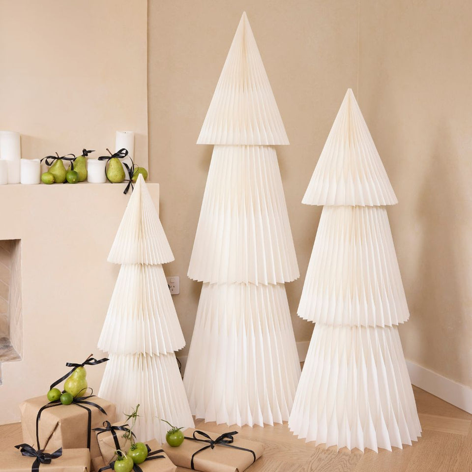 A set of three white, paper Christmas trees with a minimalist design,