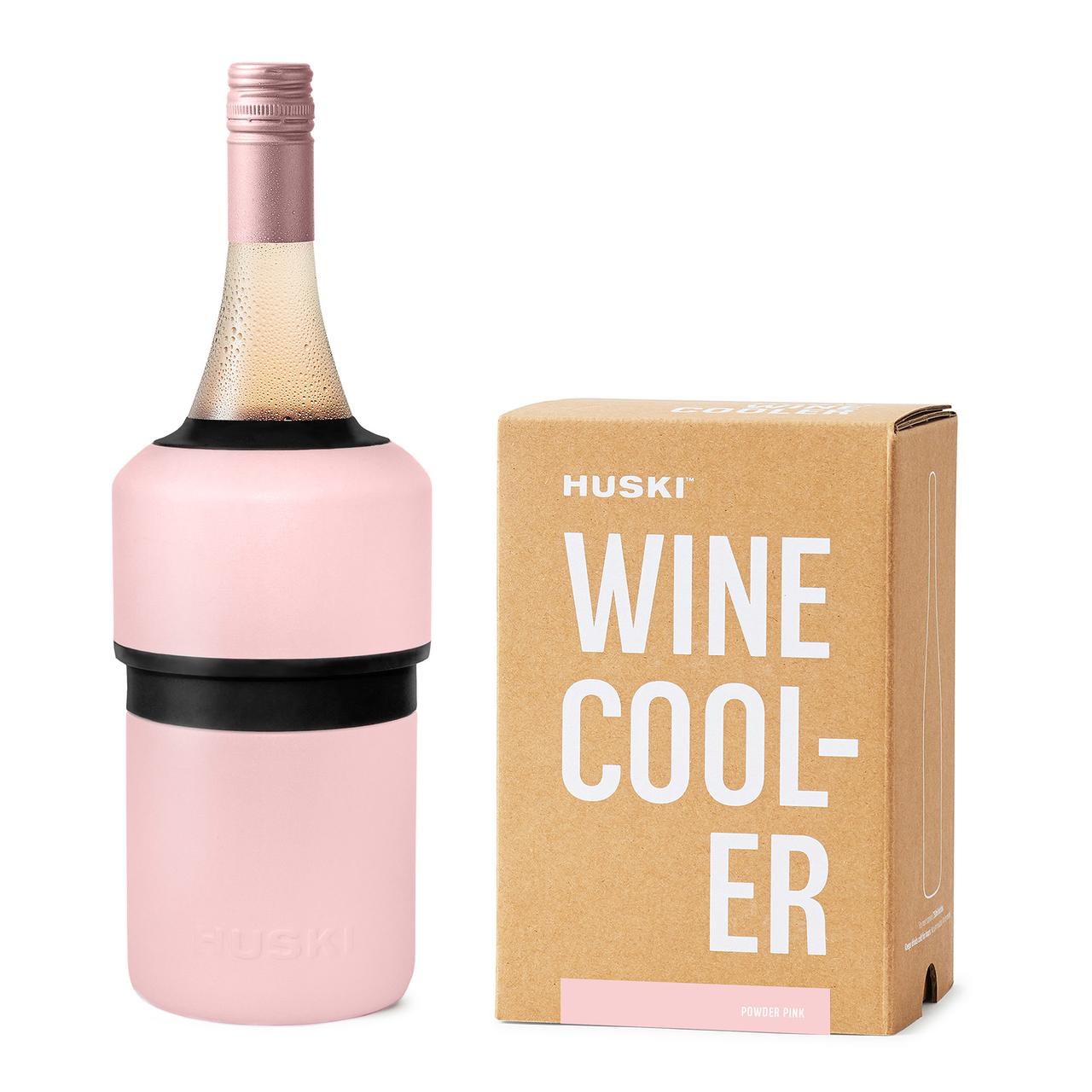 A pink Huski Wine Cooler next to its packaging box with the text 'WINE COOLER' visible on both the product and the box.