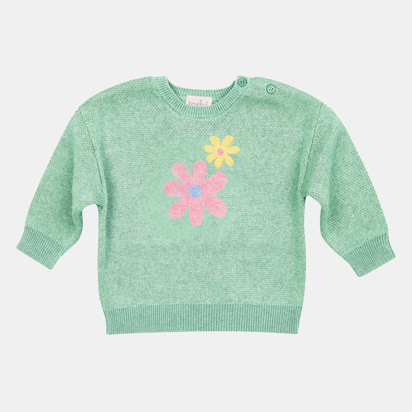 A green organic pullover for babies with a jacquard design featuring floral patterns on the front and buttons on the shoulder.