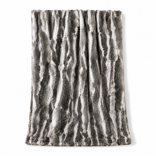 A rectangular faux fur throw blanket with a gray and white bark-like vertical stripe pattern, shown against a plain white background.