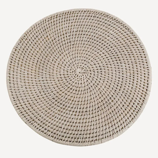 A round rattan white placemat in a natural light beige tone, shown from a top-down perspective on a solid white background.