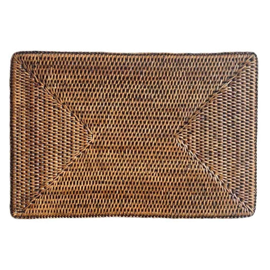 A rectangular brown rattan placemat with a woven pattern.