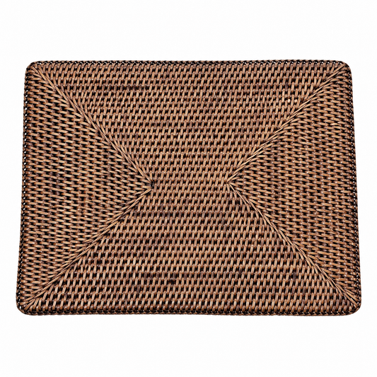 A  rectangular rattan woven placemat with a textured basketweave pattern in natural tan and dark brown,